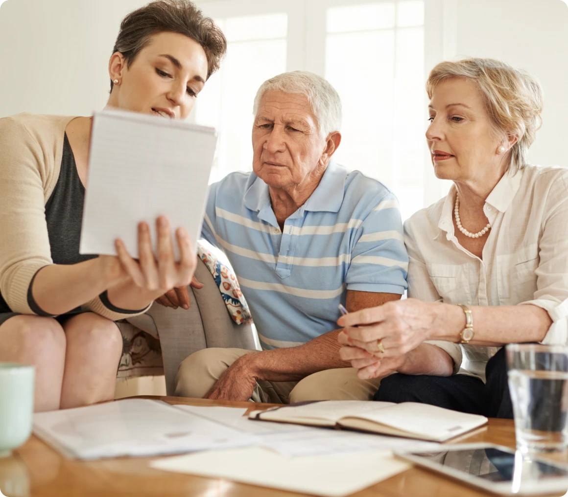Consultation meeting with older couple at home
